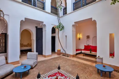 a living room with a couch and a table at Hotel & Spa Dar Baraka & Karam in Marrakech