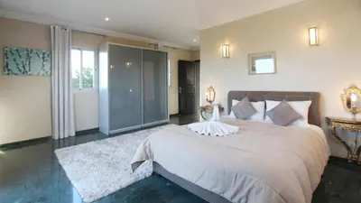 a bedroom with a large bed in a room at Palais Ambrine in Marrakech
