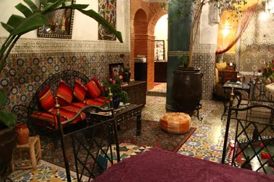 a living room with a couch and a table at Riad Bibtia in Marrakech