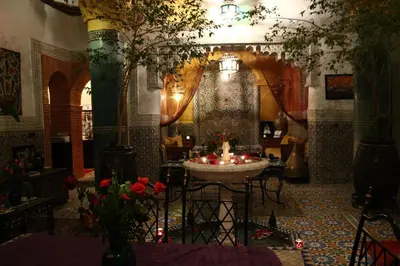 a room with a table with a candle in it at Riad Bibtia in Marrakech