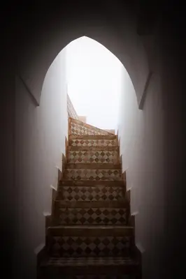 a set of stairs with a light at the top at Riad Assala in Marrakech