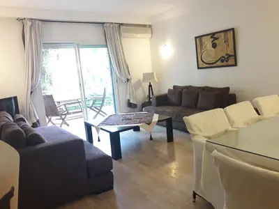 a living room with a couch and a table at Luxury appartement 105m2-hivernage-Sofitel in Marrakech