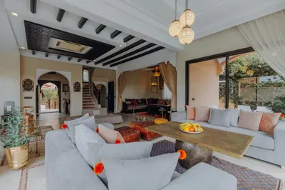 a living room with couches and a table at Villa Nelya in Marrakech