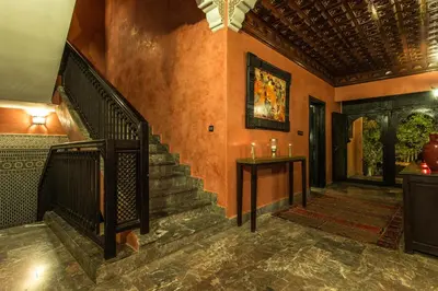 a hallway of a house with a staircase and a stair case at Villa Amira & Spa in Marrakech
