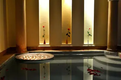 a room with a glass table with flowers on the windows at Dar Crystal in Marrakech