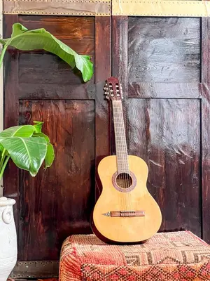 a wooden guitar sitting on top of a table at Riad Elli Marrakech in Marrakech