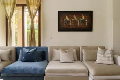 a living room with a couch with pillows on it at Marrakech Pearl in Marrakech