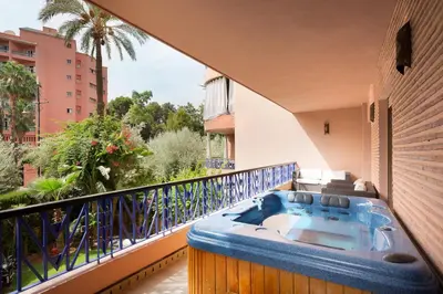 a hot tub on the balcony of a house at The Sapphire Apartment with Private Swimming Pool & Hot Tub - Hivernage Quarter - By Goldex Marrakech in Marrakech
