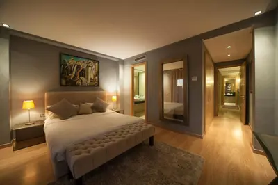 a bedroom with a large bed and a large mirror at Villa Loubane in Marrakech