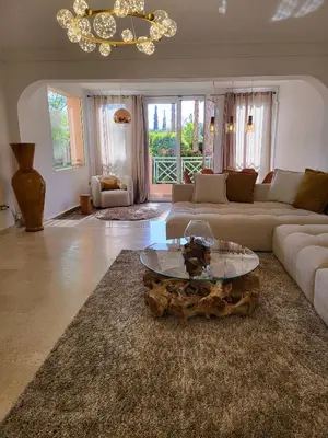a living room with a couch and a coffee table at Oxygène in Marrakech