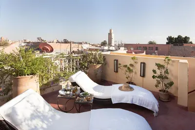 an apartment balcony with a view of a city at Riad Cocoon in Marrakech