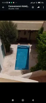 a picture of a swimming pool in a yard at Caravan Serai in Douar Khalifa Ben Mbarek