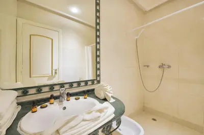 a bathroom with a sink and a shower at Mogador Menzah Appart Hôtel in Marrakech