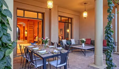 a dining room with a table and chairs at Villa de Luxe avec Piscine Privée et Golf in Marrakech