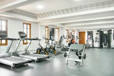 a gym with several treadmills and exercise bikes at Iberostar Waves Club Palmeraie Marrakech All Inclusive in Marrakech