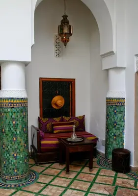 a living room with a couch and a table at Riad Tahar Oasis in Marrakech