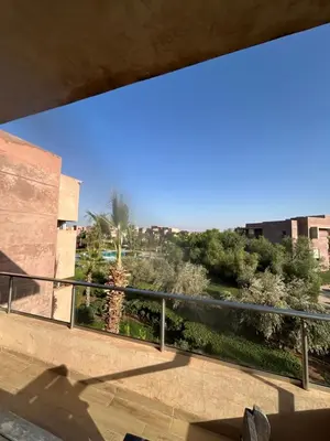 a view from the balcony of a building at Prestigia golf pour les familles in Marrakech