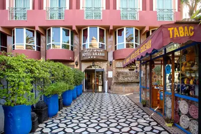 a street in front of a pink building at Hotel Akabar in Marrakech