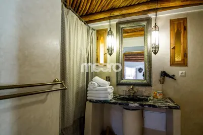 a bathroom with a sink and a mirror at Riad Zineb in Marrakech