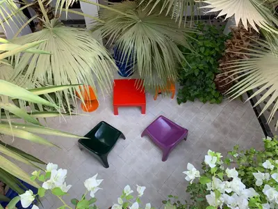 an overhead view of a patio with chairs and plants at Riad Rockech in Marrakech