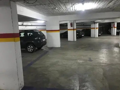 a parking garage with a car parked in it at Residence Hotel Assounfou in Marrakech