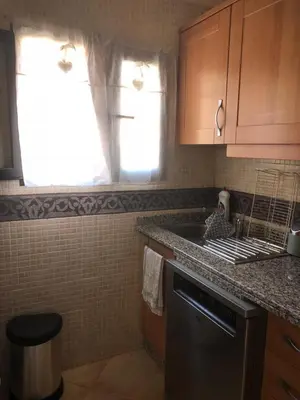 a kitchen with a sink and a counter top at Magnifique Appt Atlas Golf Resort Marrakech in Marrakech