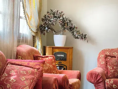 a room with two chairs and a table with a plant at Oranger Family House Marrakech City Center in Marrakech