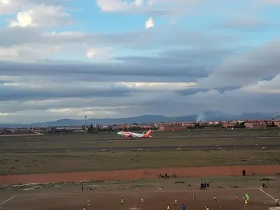 a plane sitting on the runway at an airport at Riad SARSAR airport in Marrakech