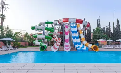 a water slide in a swimming pool at Rose Aqua Park Hotel in Marrakech