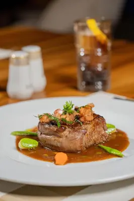 a plate of food with a piece of meat and vegetables at Al Maaden Villa Hotel & Spa in Marrakech