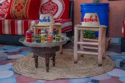 a living room with a table with drinks on it at Riad Arabic House & Spa in Marrakech
