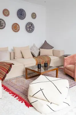 a living room with a couch and a table at Riad Bibazia in Marrakech
