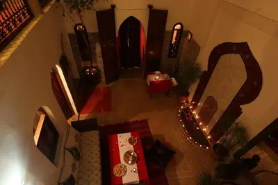 an overhead view of a living room with a table and a mirror at Riad Zehar & Spa Marrakech in Marrakech