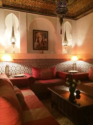 a living room with couches and tables and lights at Riad Viva in Marrakech