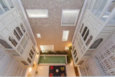 an overhead view of a building with a swimming pool at BCK Art Riad in Marrakech