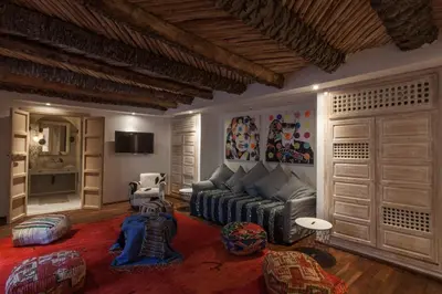 a living room with a couch and a table at BCK Art Riad in Marrakech