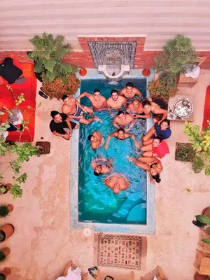 a group of people in a swimming pool at Riad 46 in Marrakech