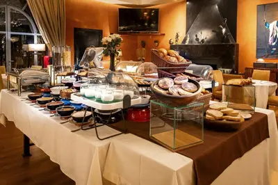a buffet table with bread and pastries on it at Palais Mirage d'Atlas, Hôtel & Spa in Marrakech