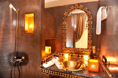 a bathroom with a sink and a mirror at Riad Belle Epoque in Marrakech