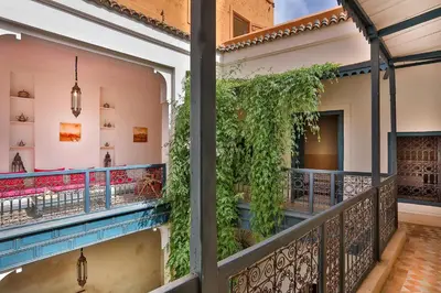 a balcony with ivy on the side of a building at Hotel & Spa Dar Sara in Marrakech