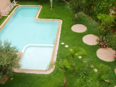 an overhead view of a swimming pool in a yard at Jnane Gueliz in Marrakech