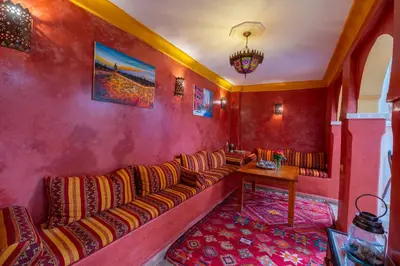 a living room with a couch and a table at Riad Mboja Chez Ali Baba in Marrakech