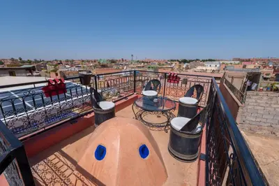 a balcony with a view of a city at Riad Mboja Chez Ali Baba in Marrakech