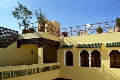 a building with plants on the top of it at Dar Taliwint in Marrakech