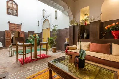 a living room with a couch and a table at Riad Amin in Marrakech