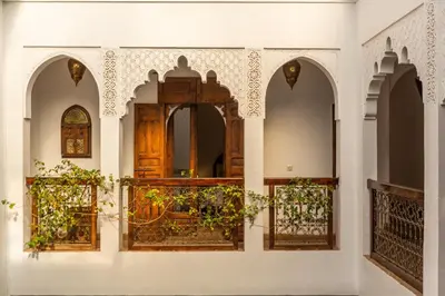 an entrance to a building with arches and a gate at Riad Amin in Marrakech