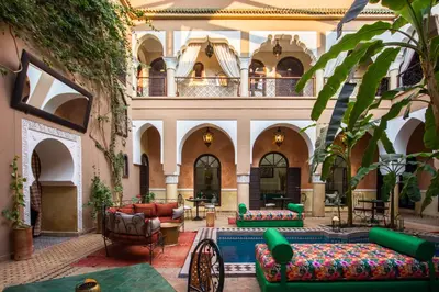 a lobby with couches and chairs in a building at Riad Nabila in Marrakech