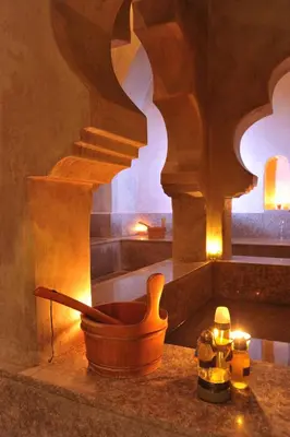 a kitchen with a wooden pot on a counter with a staircase at Pickalbatros Hôtel Du Golf - Adults Friendly 16 Years Plus- All-Inclusive in Marrakech