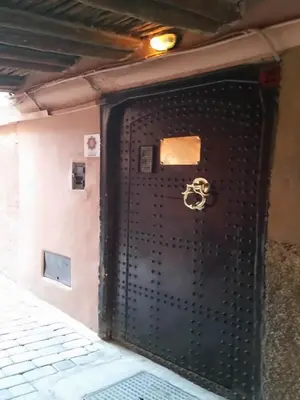 a black door with a skull on it at Riad Malika in Marrakech
