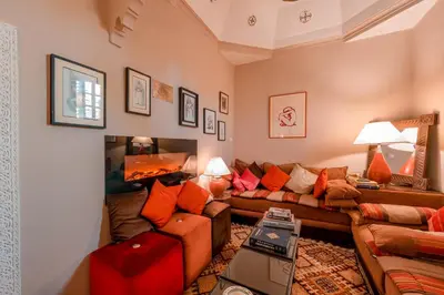a living room with a couch and a table at Abelia Riad - 2025 Guest Choice Award in Marrakech